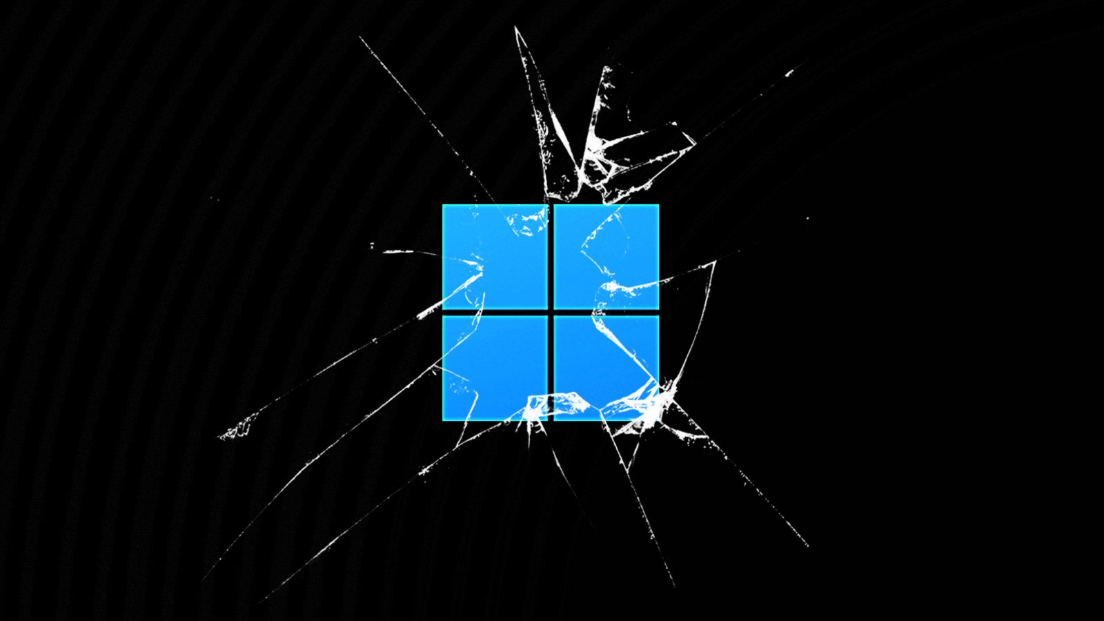 Windows 11 logo behind broken glass