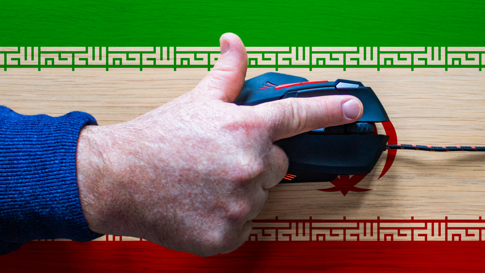 Hand on keyboard with Iranian flag background