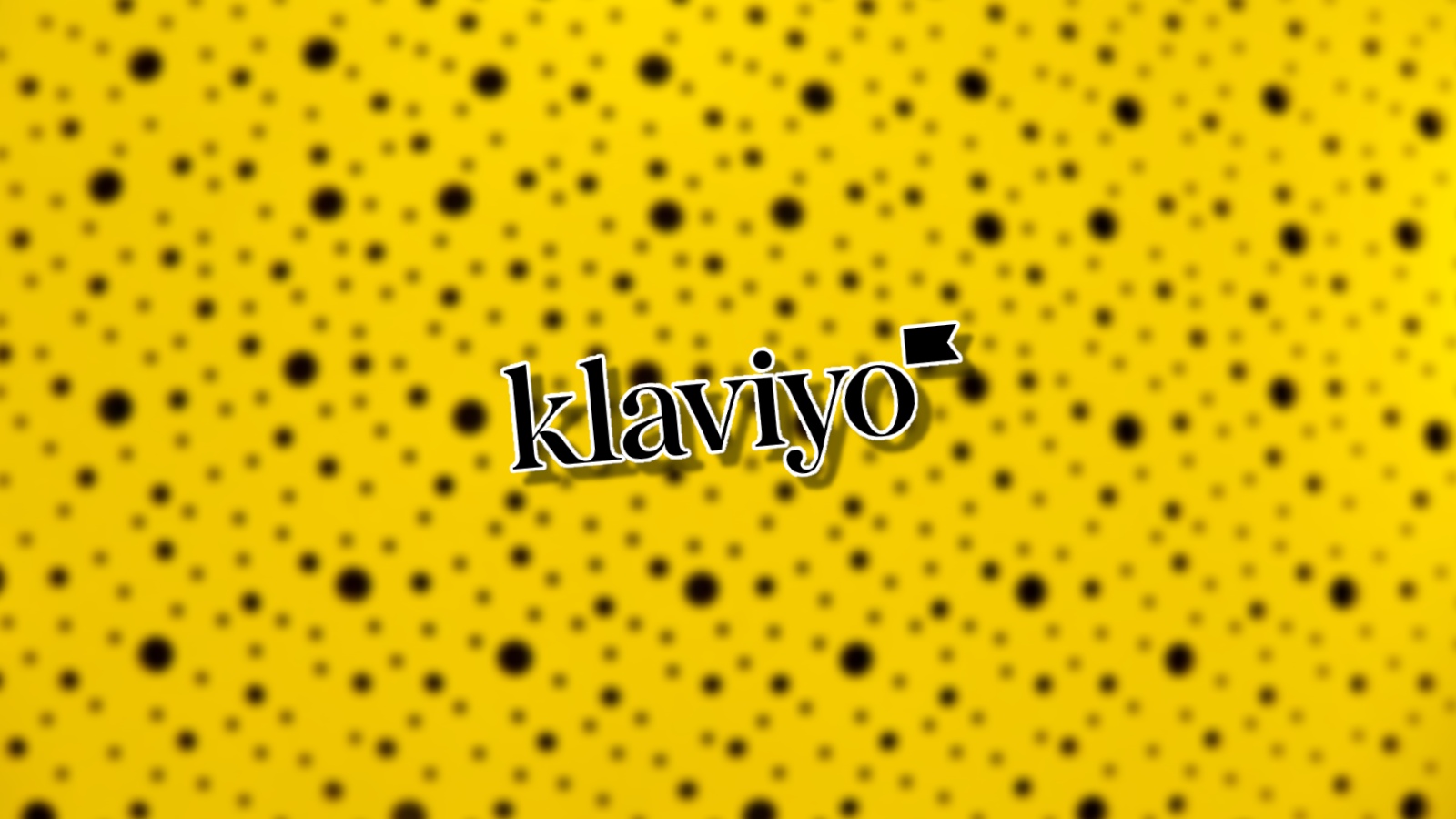 Klaviyo logo on a yellow polka-dotted background
