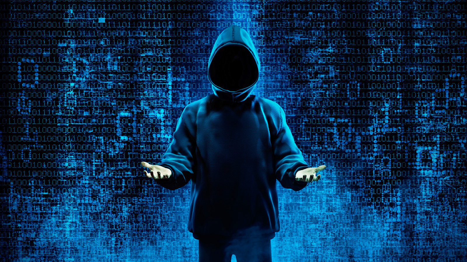 Hacker with raised arms