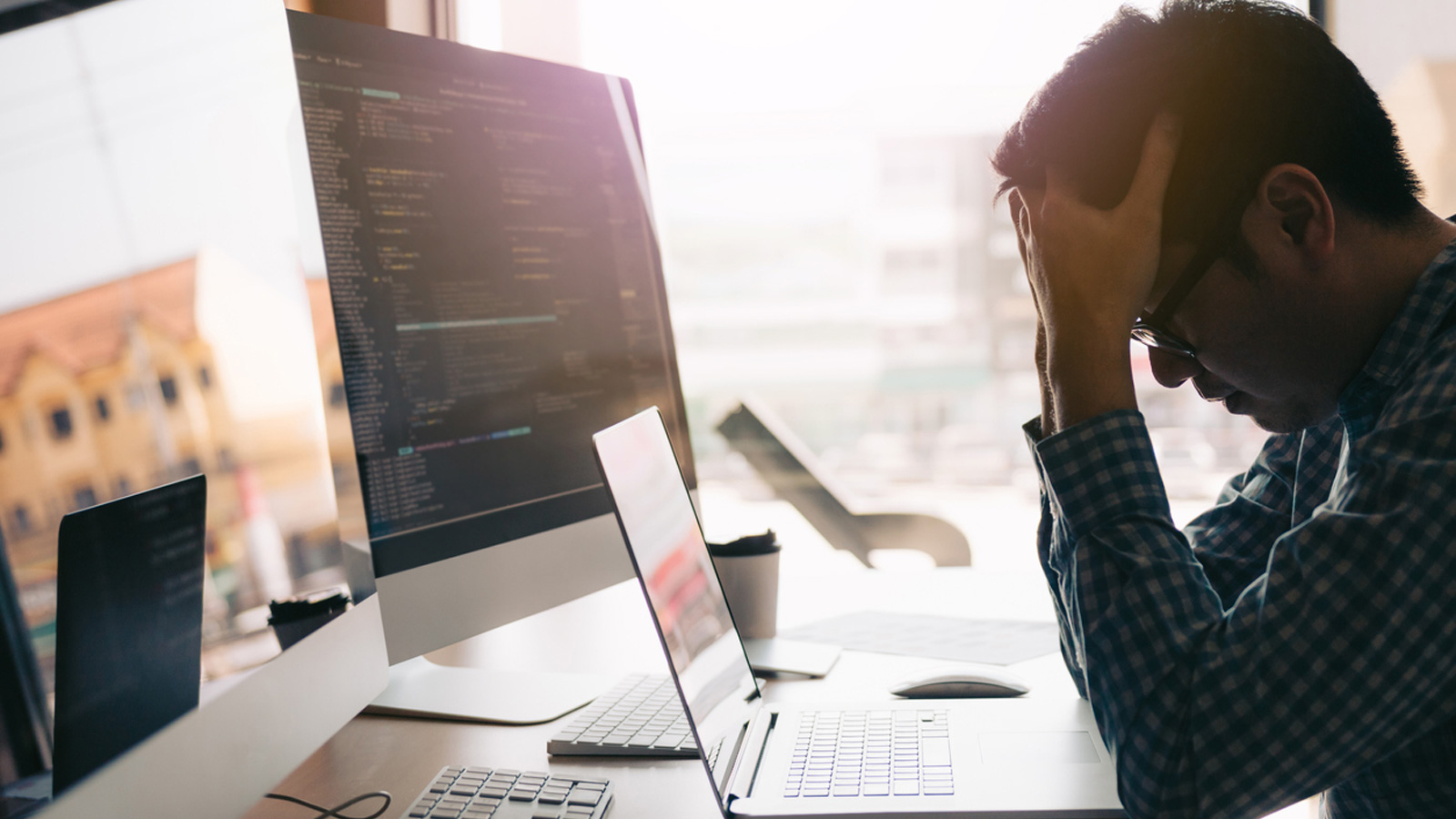 Worker tense in front of his computer