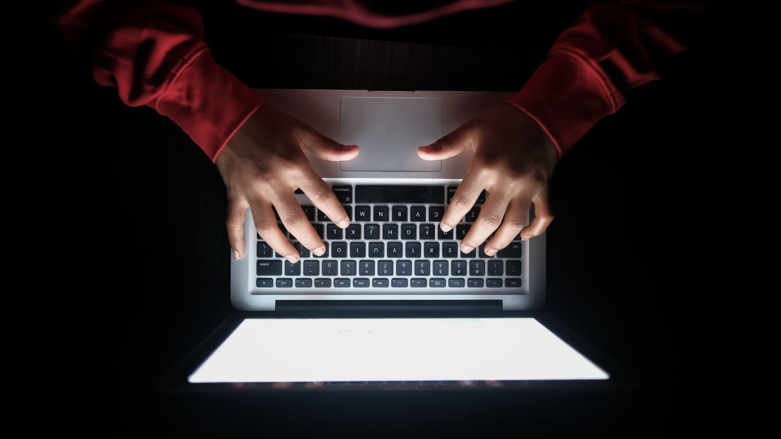 Person typing on laptop