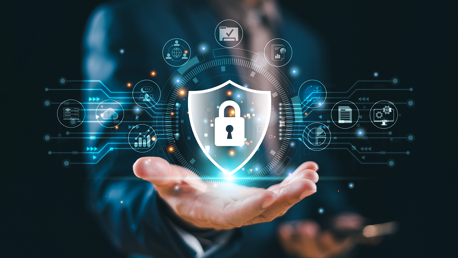 Hand holding cybersecurity symbols