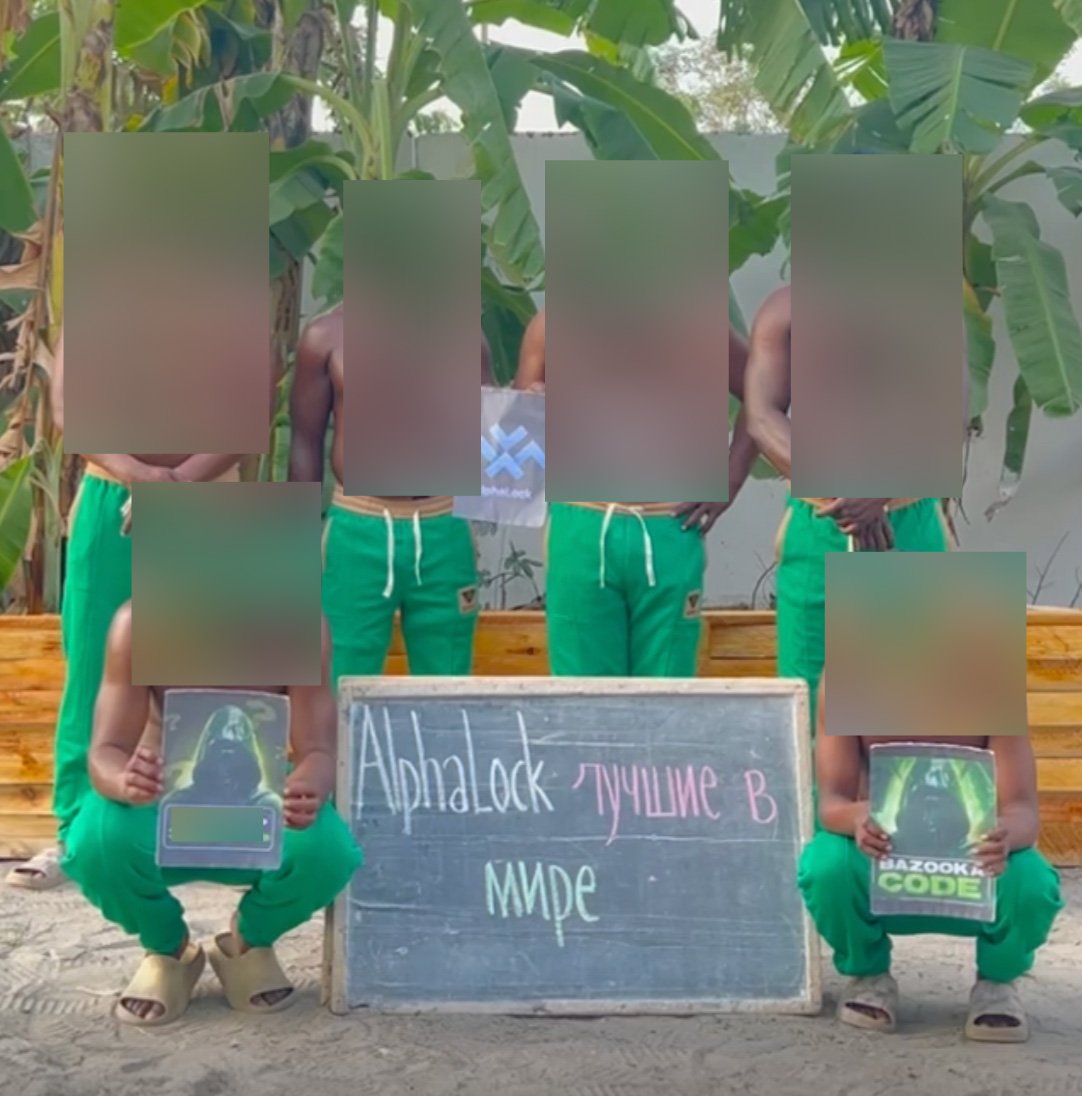 Six people pose with promotional materials for AlphaLock and the Bazooka Code course